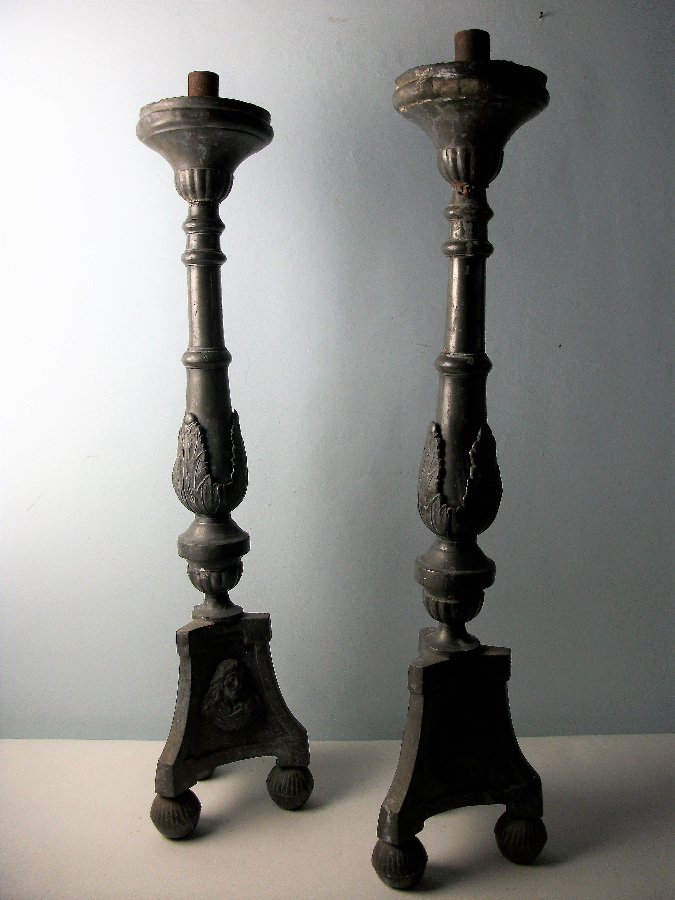 a pair of pewter candlesticks